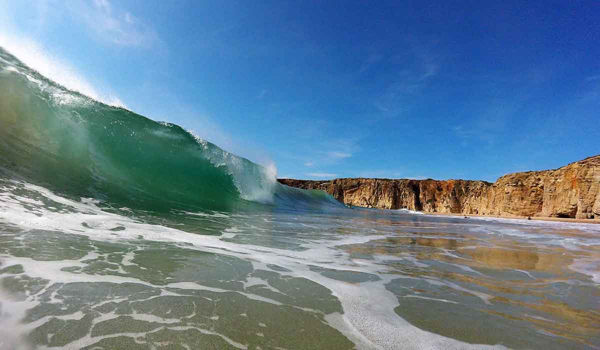 Perfect surf waves at Praia do Beliche, Sagres